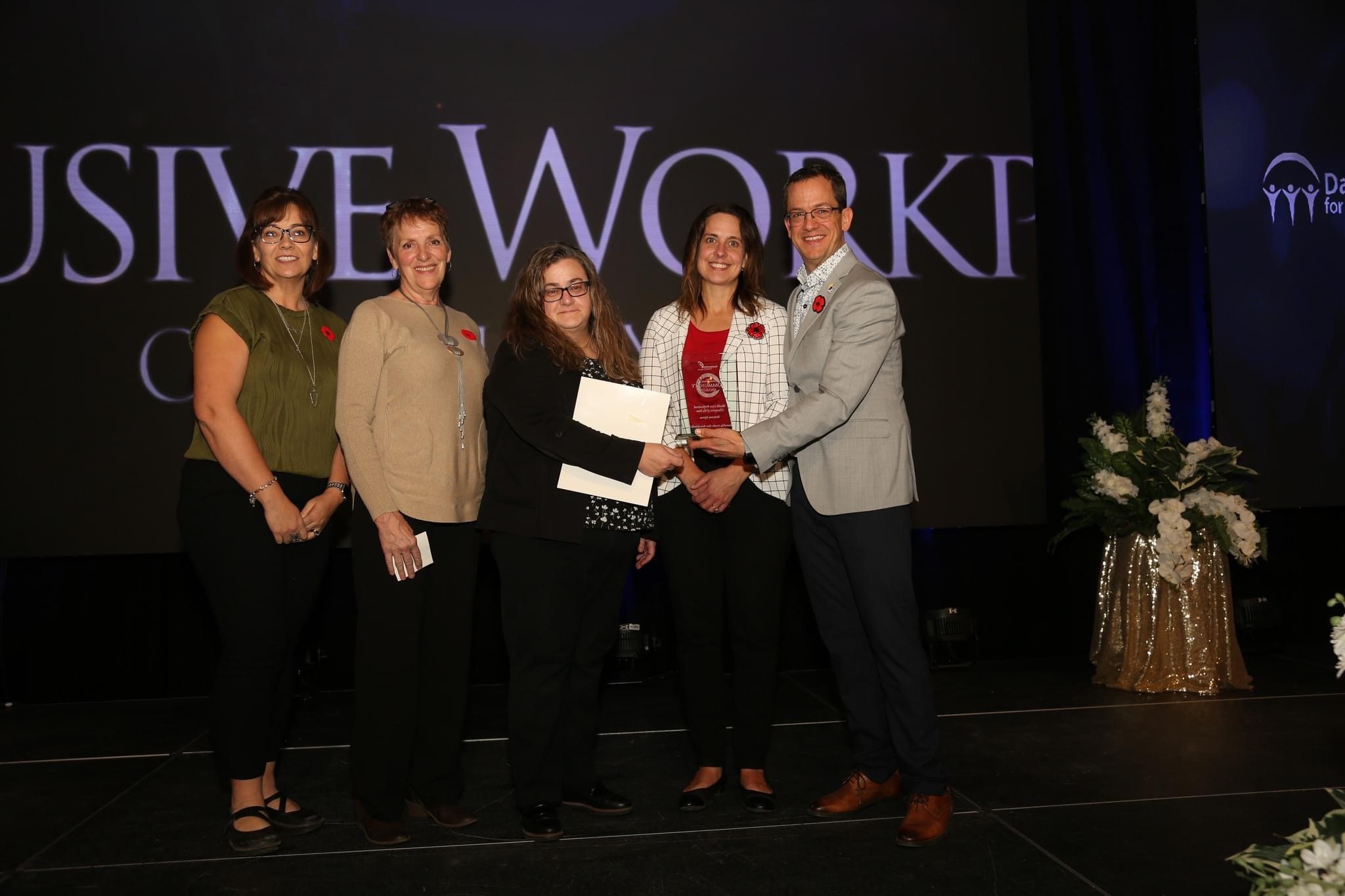 staff accepting award